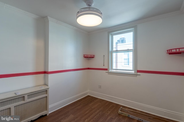 unfurnished room with radiator heating unit, dark hardwood / wood-style floors, and ornamental molding