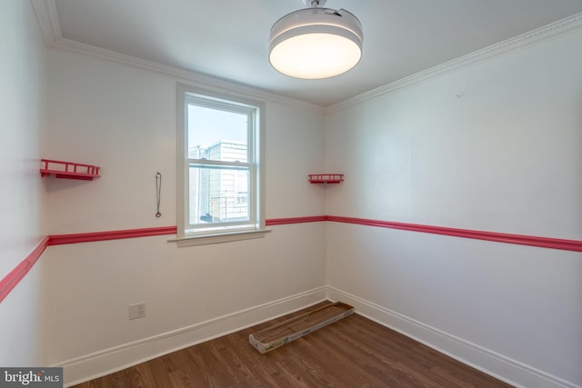 unfurnished room featuring crown molding and dark wood-type flooring