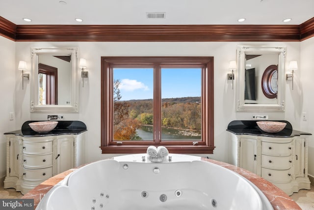 bathroom featuring a tub and crown molding