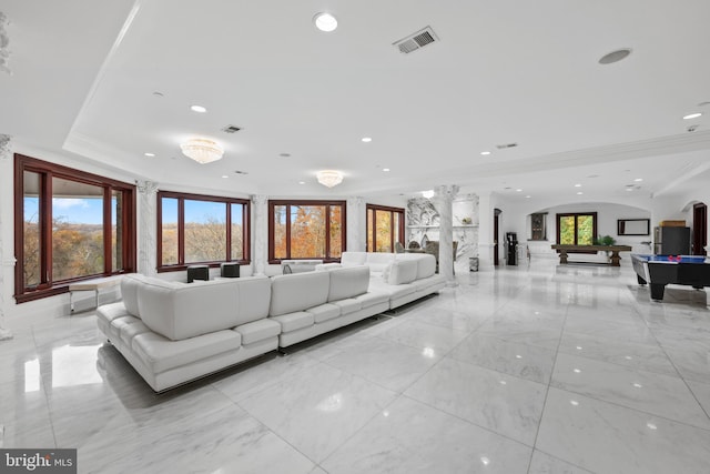 living room with plenty of natural light, pool table, and crown molding