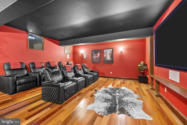 home theater room with wood-type flooring