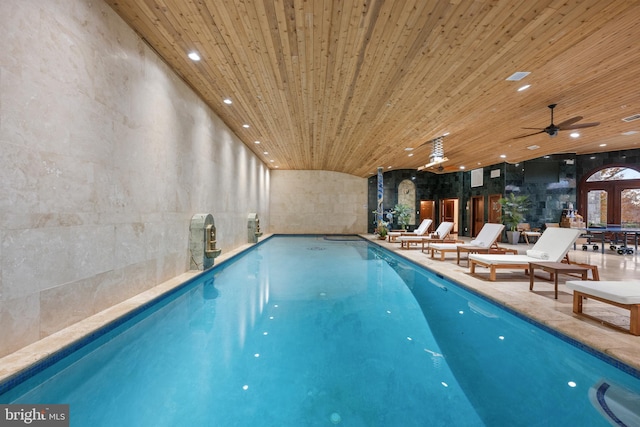 view of swimming pool with ceiling fan and a patio