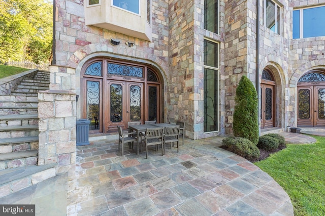 property entrance featuring a patio area