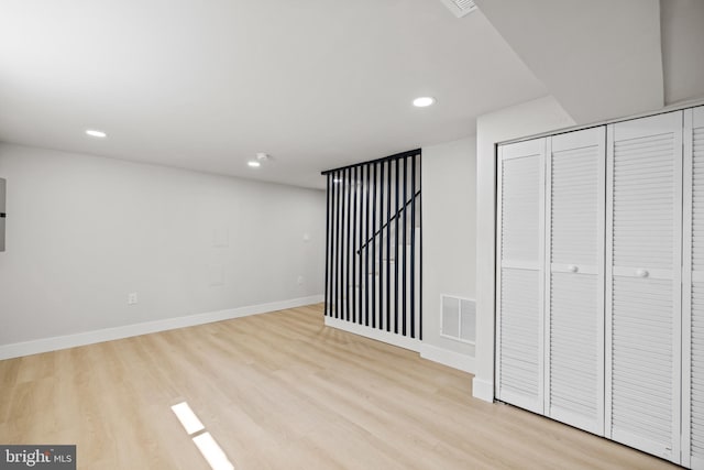 interior space featuring light hardwood / wood-style flooring and a closet