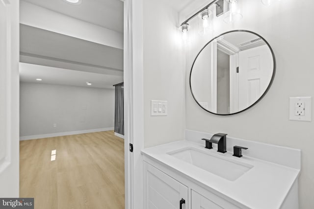 bathroom featuring vanity and hardwood / wood-style flooring