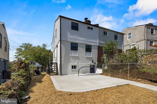 back of house with a patio