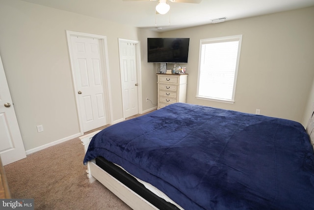 bedroom featuring ceiling fan and carpet