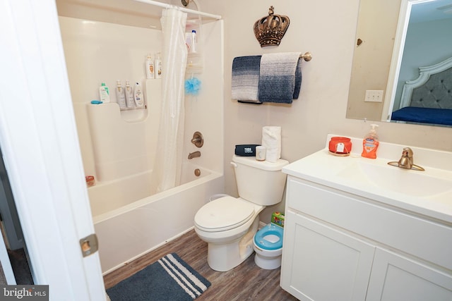 full bathroom featuring vanity, toilet, shower / tub combo, and wood-type flooring