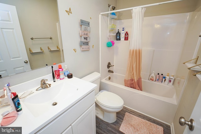 full bathroom featuring vanity, toilet, shower / tub combo with curtain, and hardwood / wood-style floors