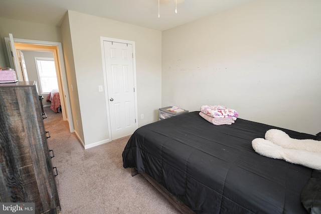 bedroom featuring light colored carpet