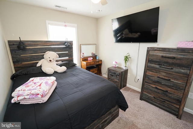 carpeted bedroom with ceiling fan