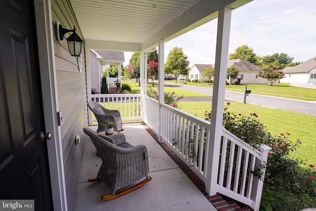 view of patio featuring a porch