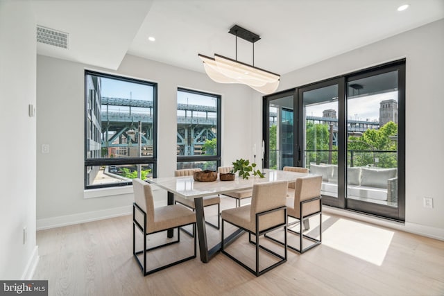 dining room with light hardwood / wood-style floors