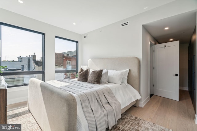 bedroom with light wood-type flooring