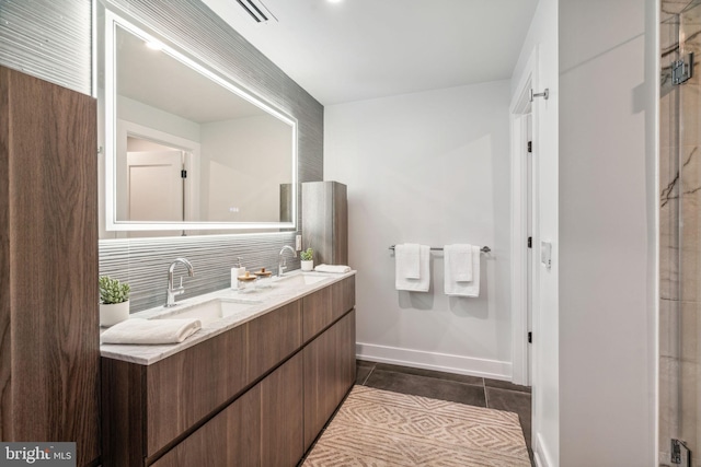 bathroom with backsplash, vanity, and tile patterned flooring