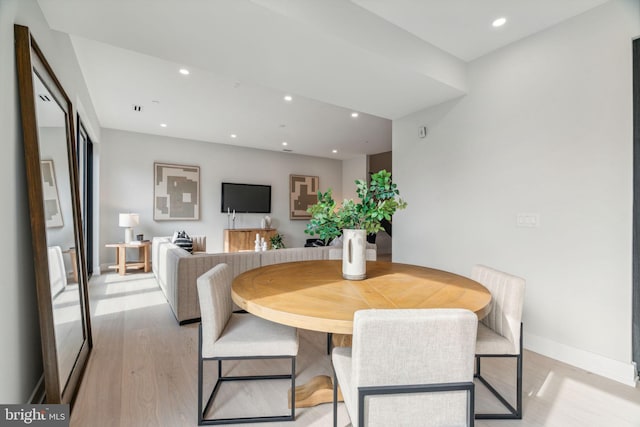 dining space with light wood-type flooring