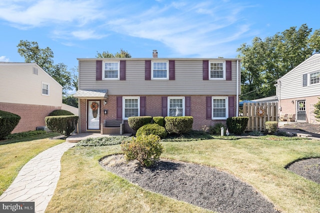 view of front facade featuring a front yard