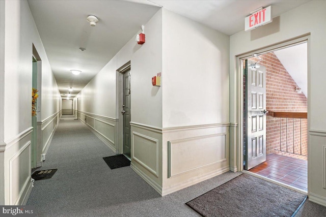 hallway with carpet flooring