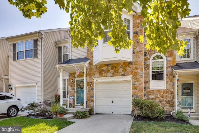 townhome / multi-family property featuring a garage