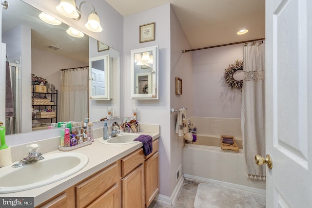 bathroom with tile patterned floors, independent shower and bath, and vanity