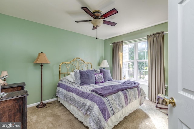 bedroom featuring ceiling fan and light colored carpet