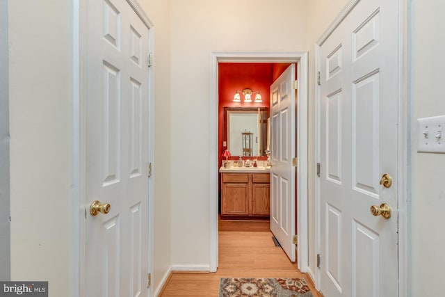 corridor featuring light hardwood / wood-style floors