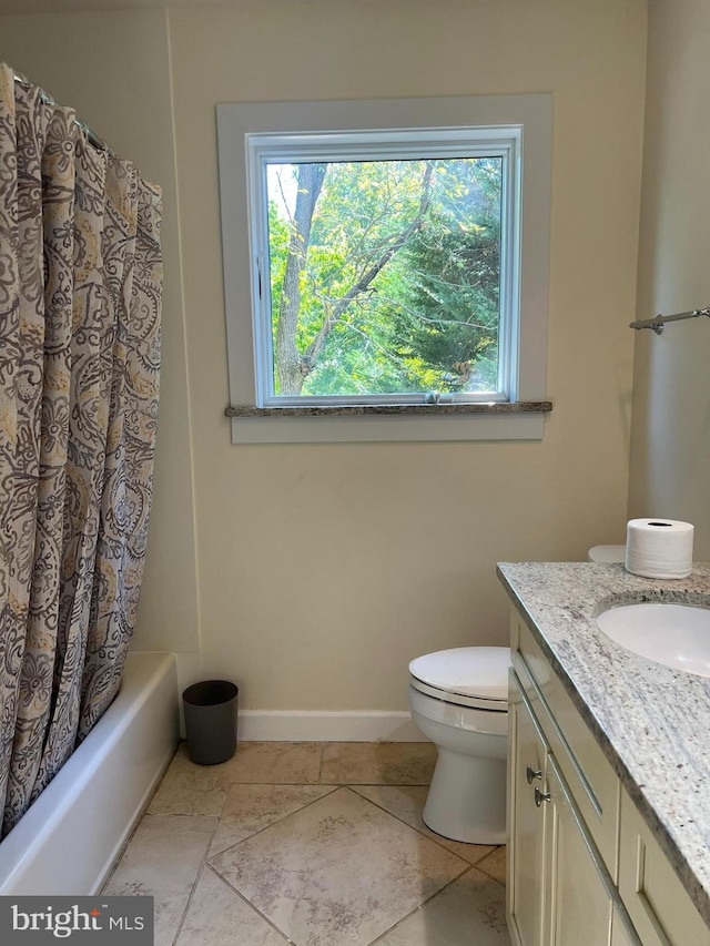 full bathroom with shower / bath combo, vanity, and toilet