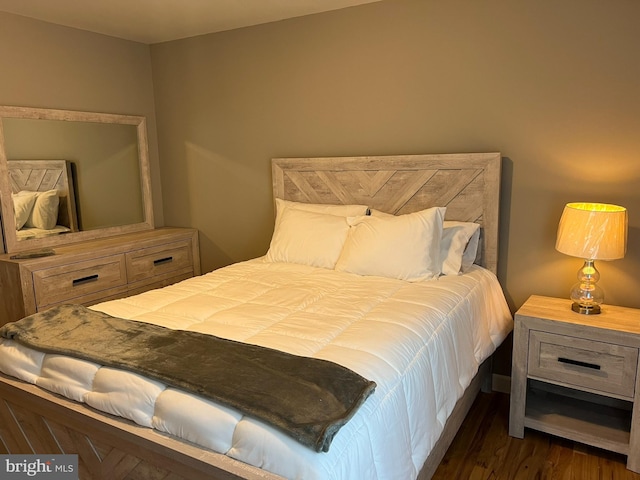 bedroom featuring dark hardwood / wood-style floors