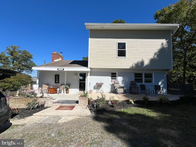 rear view of house featuring a patio area