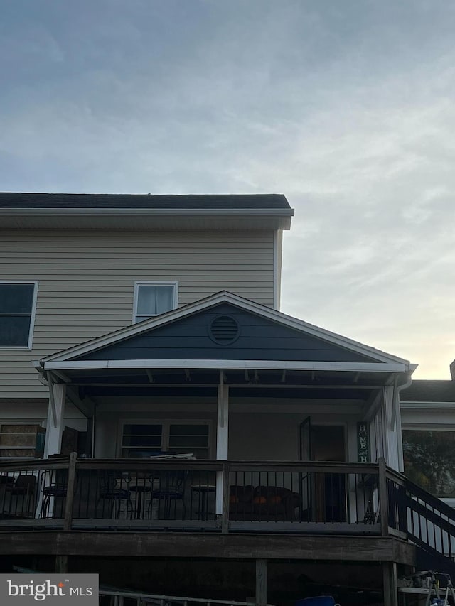 view of back house at dusk