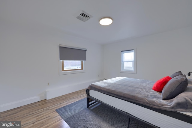 bedroom featuring light wood-type flooring