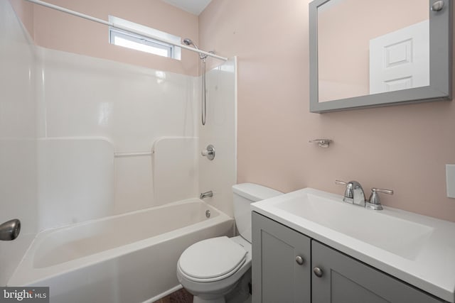 full bathroom featuring tub / shower combination, vanity, and toilet