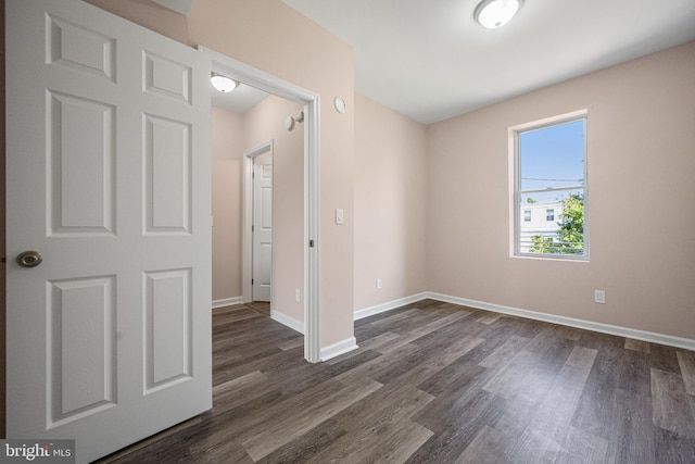 empty room featuring dark hardwood / wood-style floors