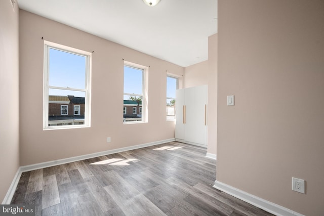 spare room with light hardwood / wood-style flooring