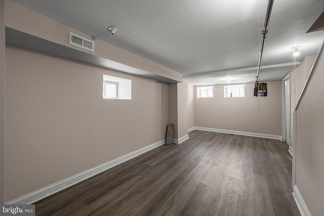 basement featuring dark hardwood / wood-style floors