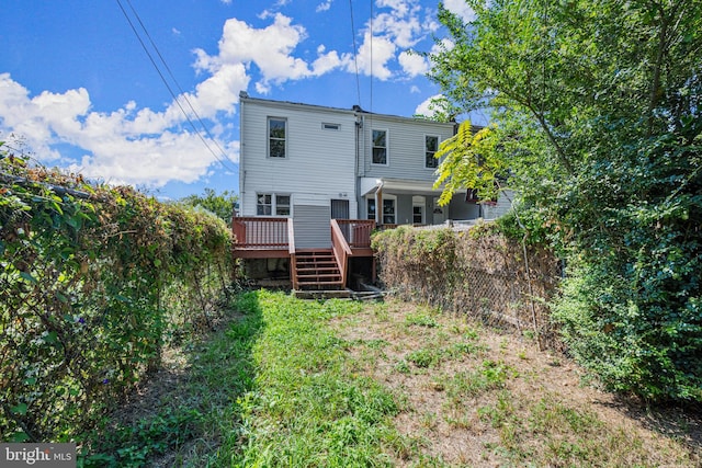 back of property featuring a deck