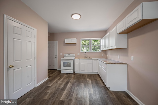 kitchen with white electric range oven, dark hardwood / wood-style floors, sink, and white cabinetry