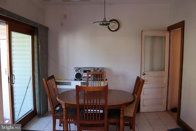 dining room featuring a healthy amount of sunlight and light tile patterned floors