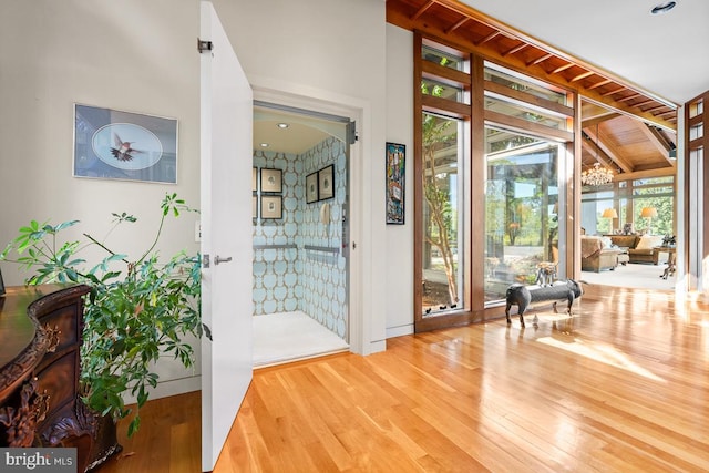 interior space with lofted ceiling and hardwood / wood-style floors