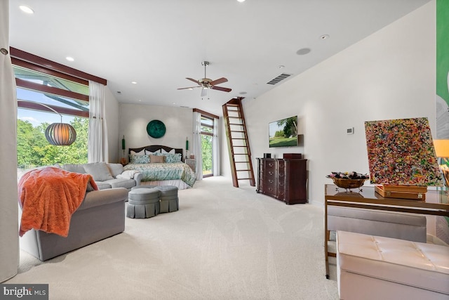 carpeted living room with ceiling fan