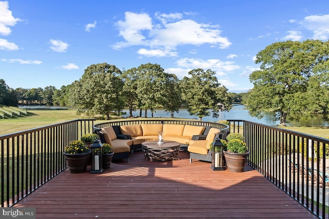 deck featuring a water view and outdoor lounge area