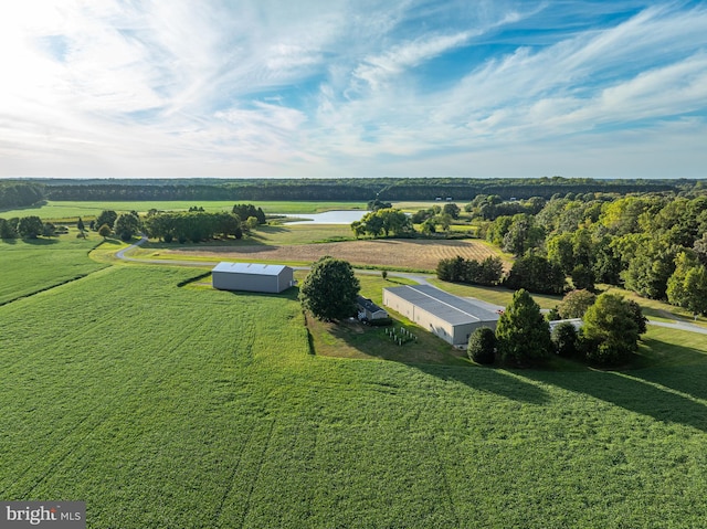 drone / aerial view featuring a water view and a rural view