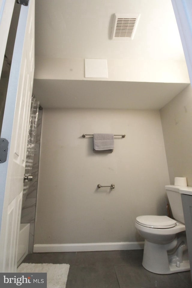 bathroom with tile patterned flooring, toilet, and separate shower and tub