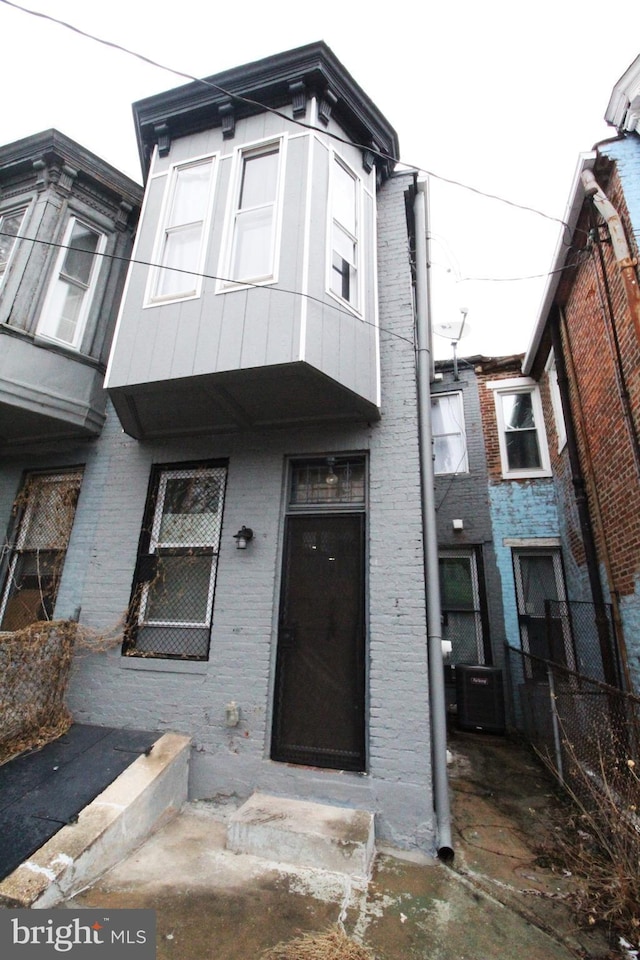 view of front of house featuring central air condition unit