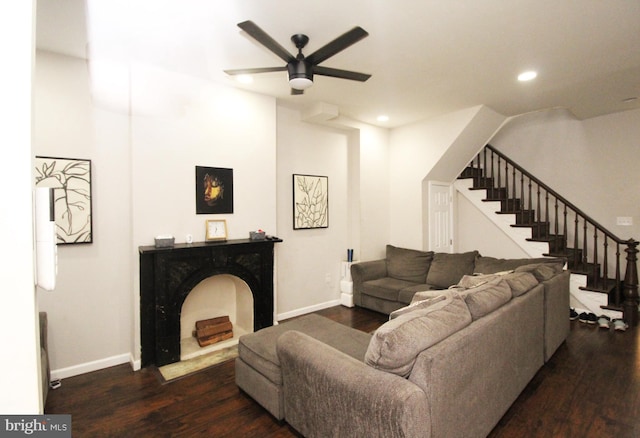 living room with dark hardwood / wood-style floors and ceiling fan