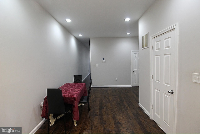 hallway featuring dark hardwood / wood-style floors