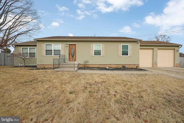 ranch-style house featuring a garage, a front yard, fence, and driveway