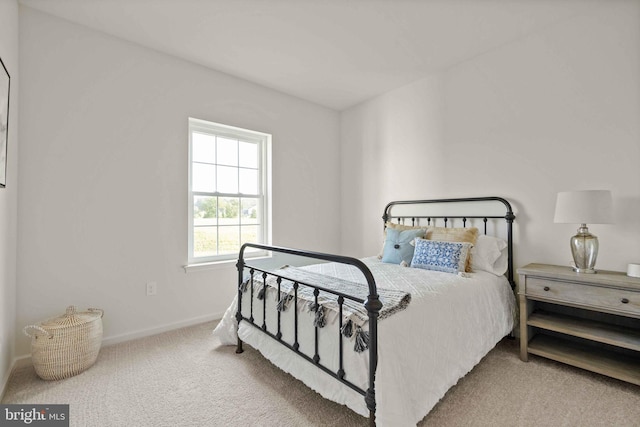 carpeted bedroom with baseboards