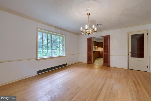 kitchen featuring dishwasher, crown molding, stovetop, and sink