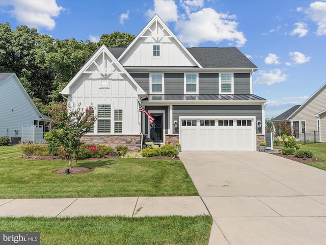 view of front of property featuring a front lawn, central air condition unit, and a garage